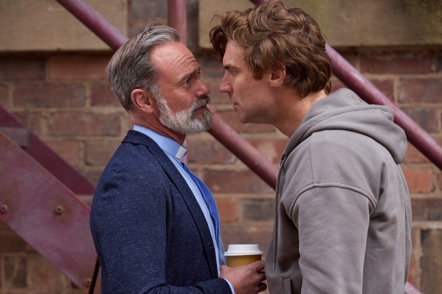 Theo aggressively confronts Billy in Corrie, appearing incredibly close to his face