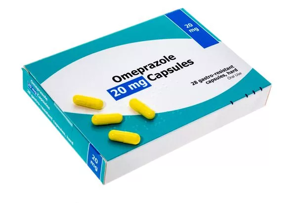Packet of generic Omeprazole pills - white background