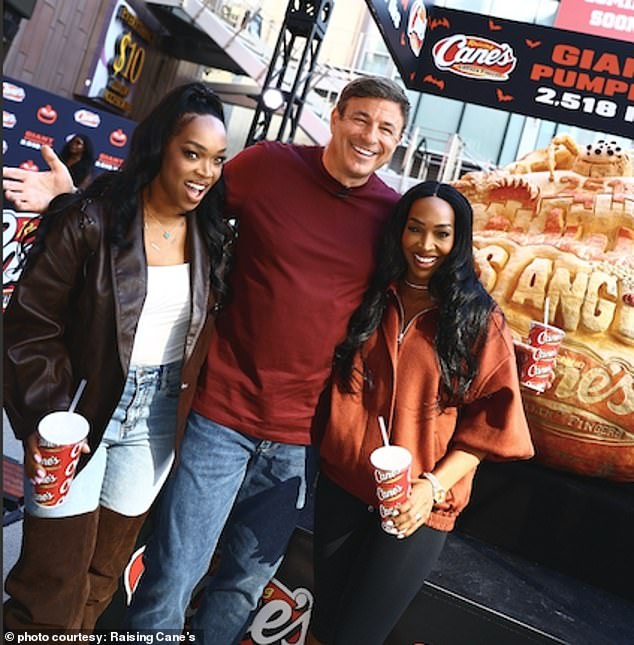 Raising Cane¿s owner and founder Todd Graves, Malika Haqq and Khadijah Haqq at Raising Cane¿s Giant Jack-O¿-Lantern unveiling on the Hollywood Walk of Fame in Los Angeles, October 29