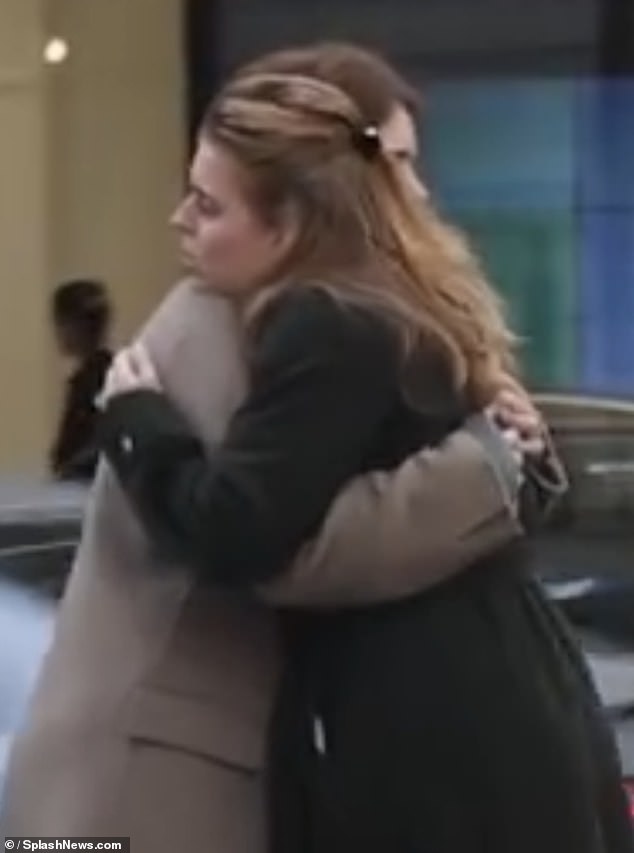 Andrew's daughters princesses Beatrice and Eugenie were pictured embracing on Thursday after their father was formally stripped of his titles
