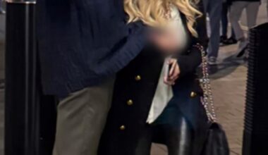 Police released this photo of two people they want to talk to after a family was allegedly racially abused and assaulted in central London (image blurred at source by British Transport Police)