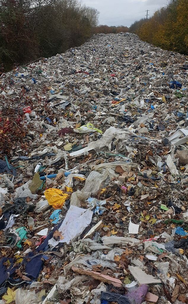 The 20ft-high pile of hazardous rubbish was illegally dumped in a field next to the A34 and River Cherwell near Kidlington in Oxfordshire