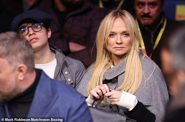 Former spice girls singer Emma Bunton clutched a bag as she sat near the ring