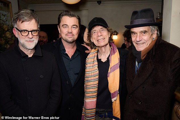Leo and Mick also posed with the film's director Paul Thomas Anderson (L) and fellow actor Jeremy Irons (R)