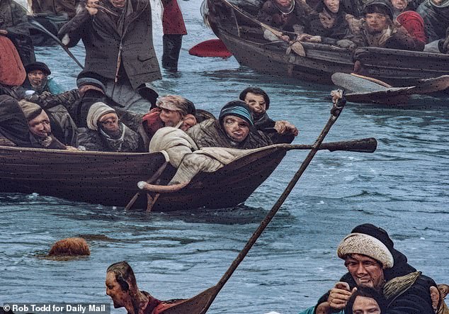 As well as featuring distended people with melted faces, the mural has oddities - such as what appears to be a floating ginger wig in the water