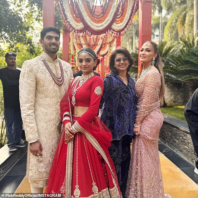 Bride Netra Mantena and groom, Vamsi Gadiraju, pictured with Jennifer Lopez
