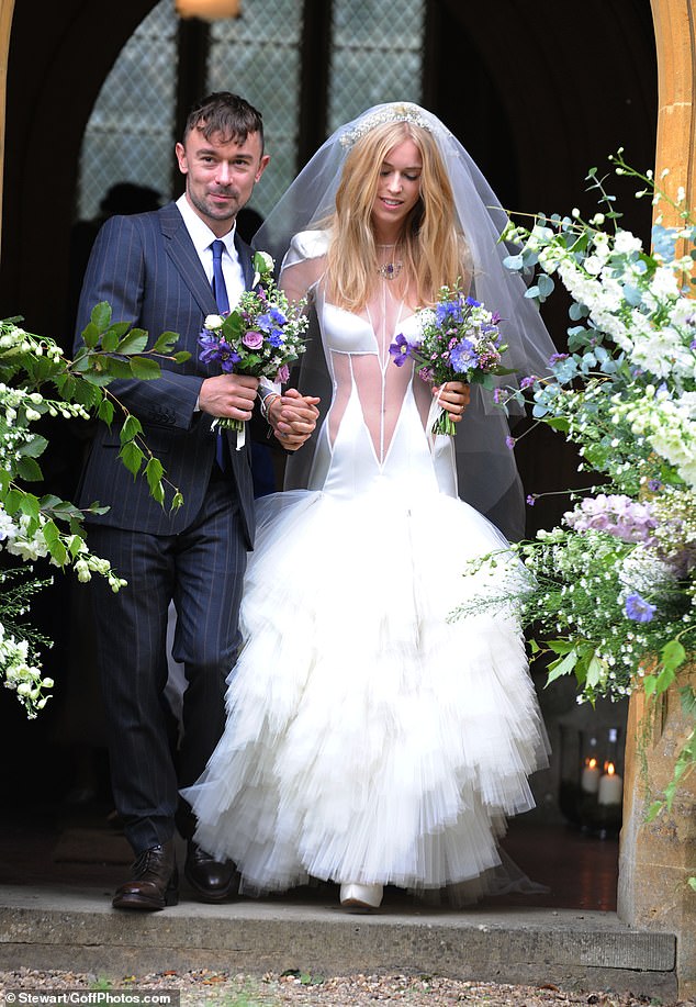 One of her most iconic creations came in 2012, when she designed a racy sheer wedding dress for Lady Mary Charteris (pictured with husband Robbie Furze)