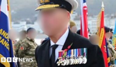 Arrest after man suspected of posing as navy admiral at Llandudno Remembrance event