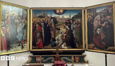 Family having a moment together messing about while winter sea swimming