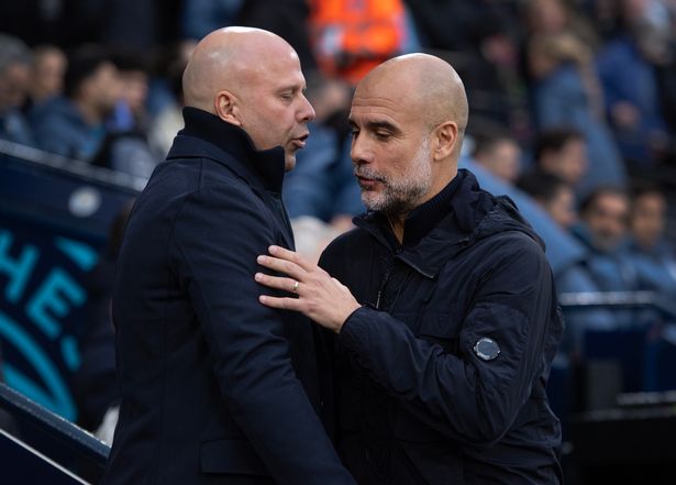 MANCHESTER, ENGLAND - FEBRUARY 23: Manchester City manager Pep Guardiola greets Liverpool manager Arne Slot before the Premier League match between Manchester City FC and Liverpool FC at Etihad Stadium on February 23, 2025 in Manchester, England. (Photo by Visionhaus/Getty Images)