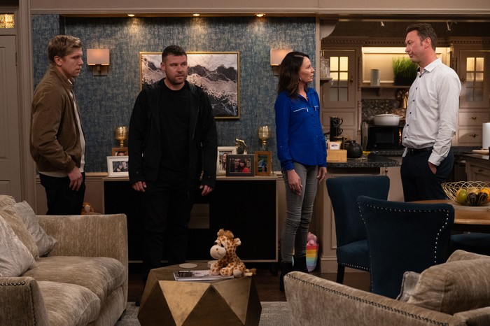 Robert, Aaron, Chas and Liam look tense in the Woolpack back room in Emmerdale