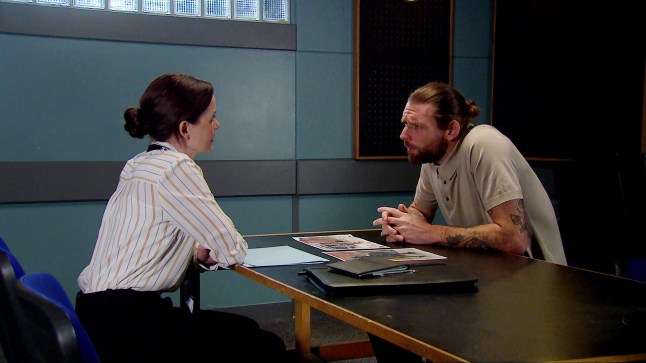 DS Carter questions Kev in a police interview room in Emmerdale