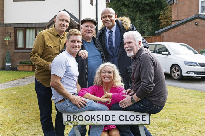 Former Brookside favourites, from left: Paul Usher (Barry), Philip Borg-Olivier (Tinhead), Michael Starke (Sinbad), Suzanne Collins (Nikki), Louis Emerick (Mick) and John McArdle (Billy) pose around the Brookside Close sign