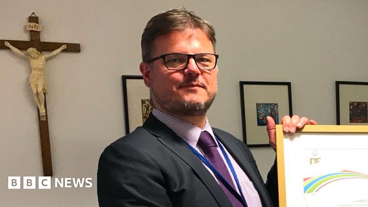 Family having a moment together messing about while winter sea swimming