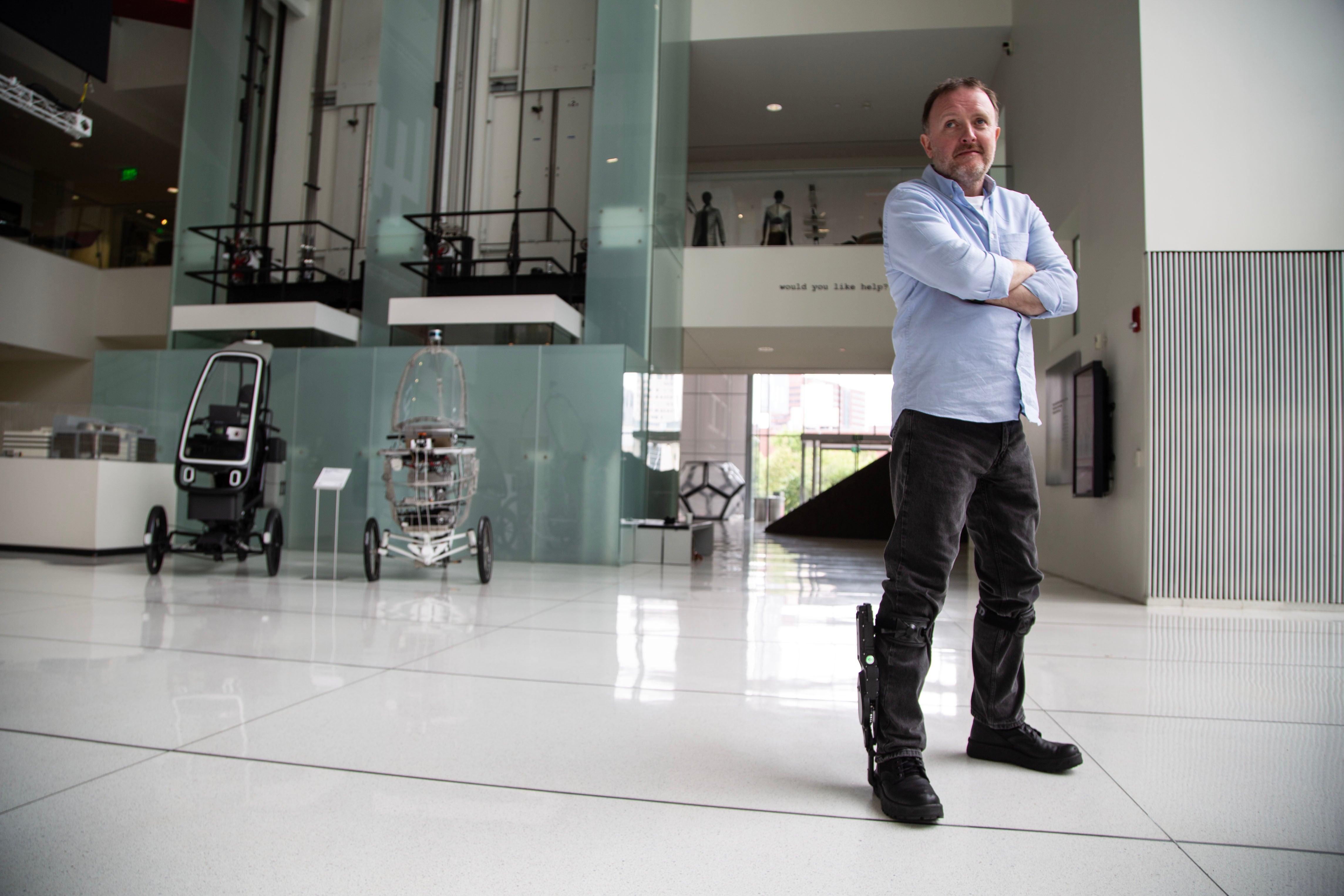 McCausland wearing exoskeleton boots in his new documentary