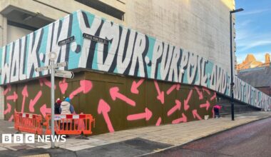 Family having a moment together messing about while winter sea swimming