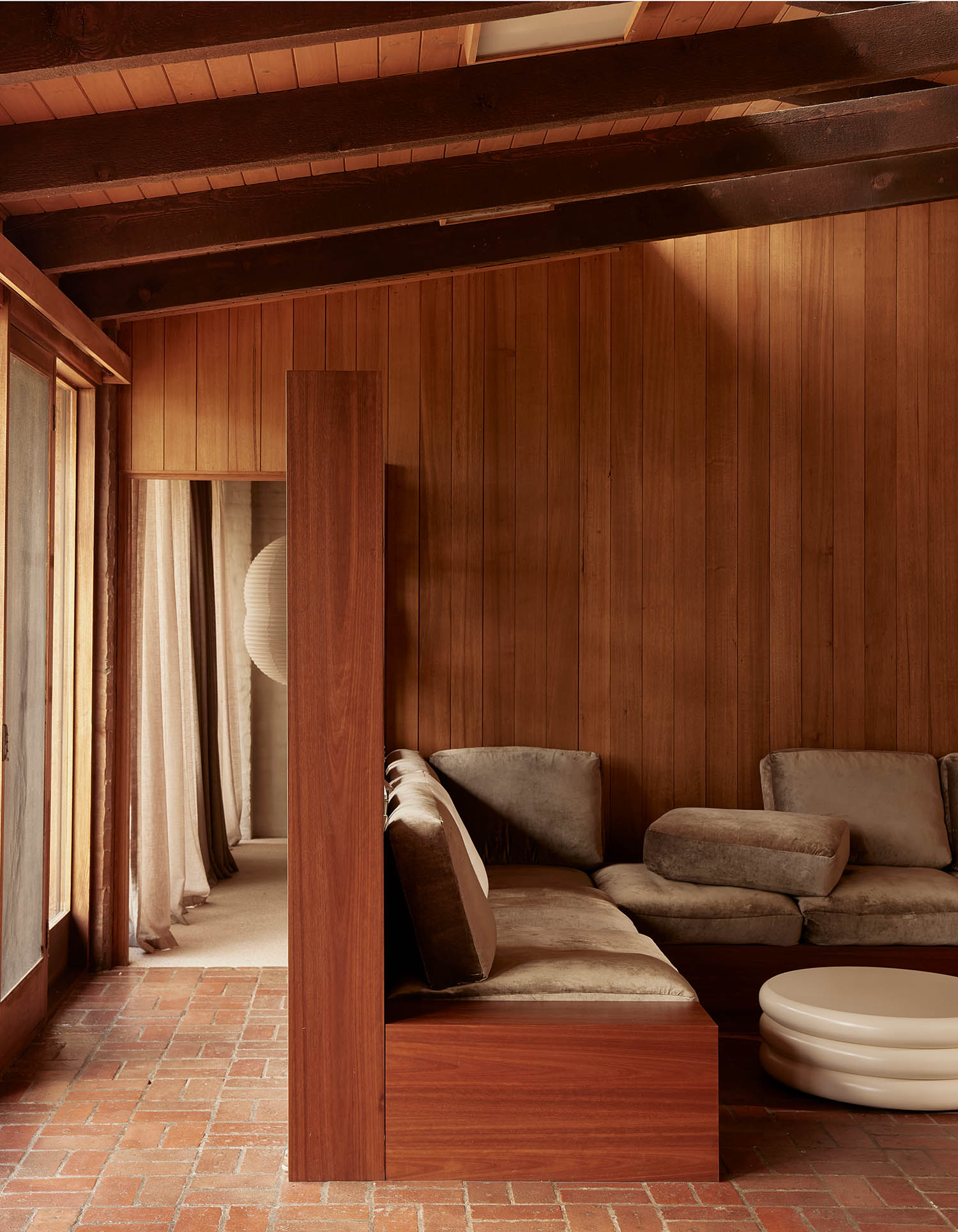 Sinking feeling: a built-in sofa inspired by the sunken living rooms of the 1970s