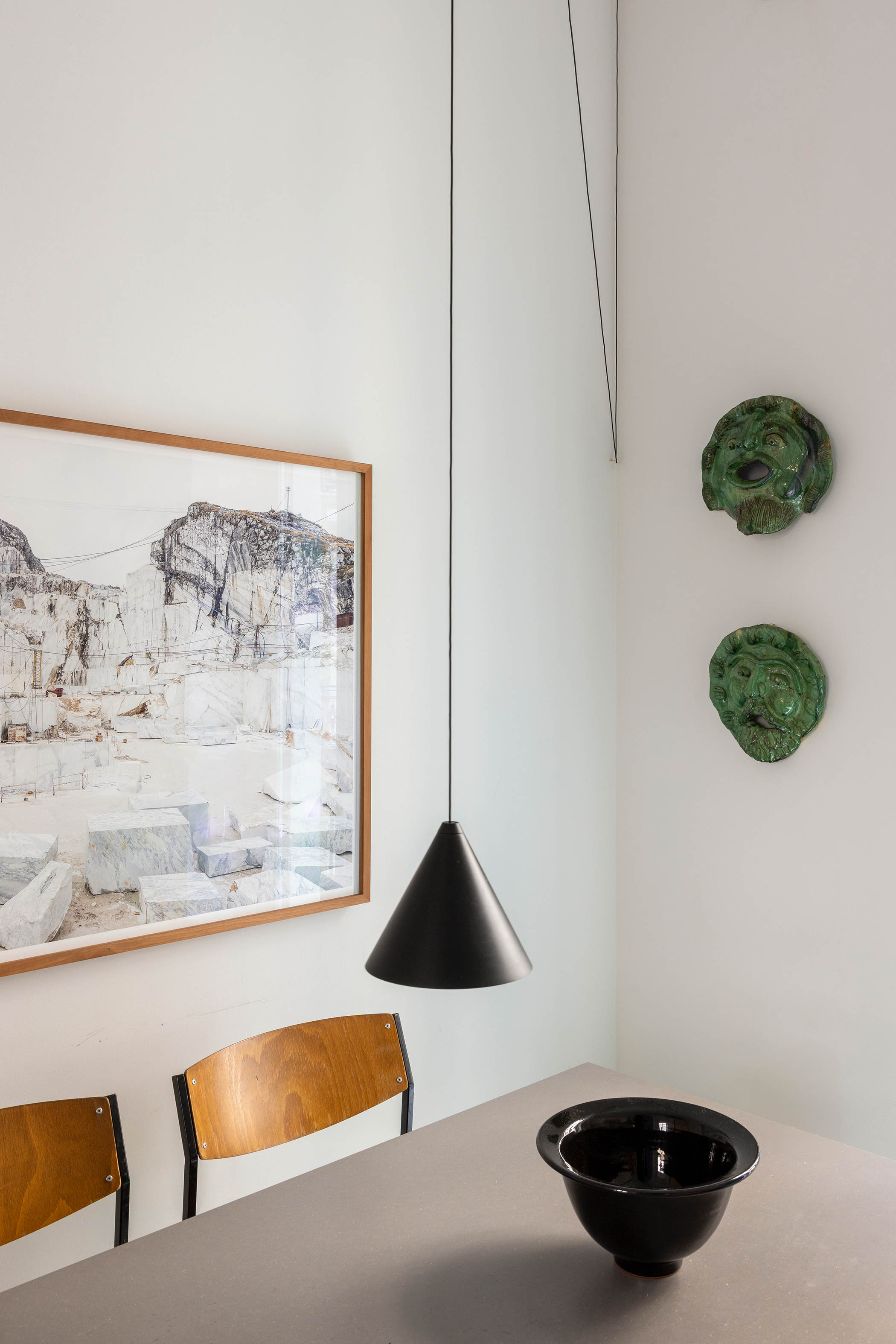 A Flos pendant light brings striking yet simple shape