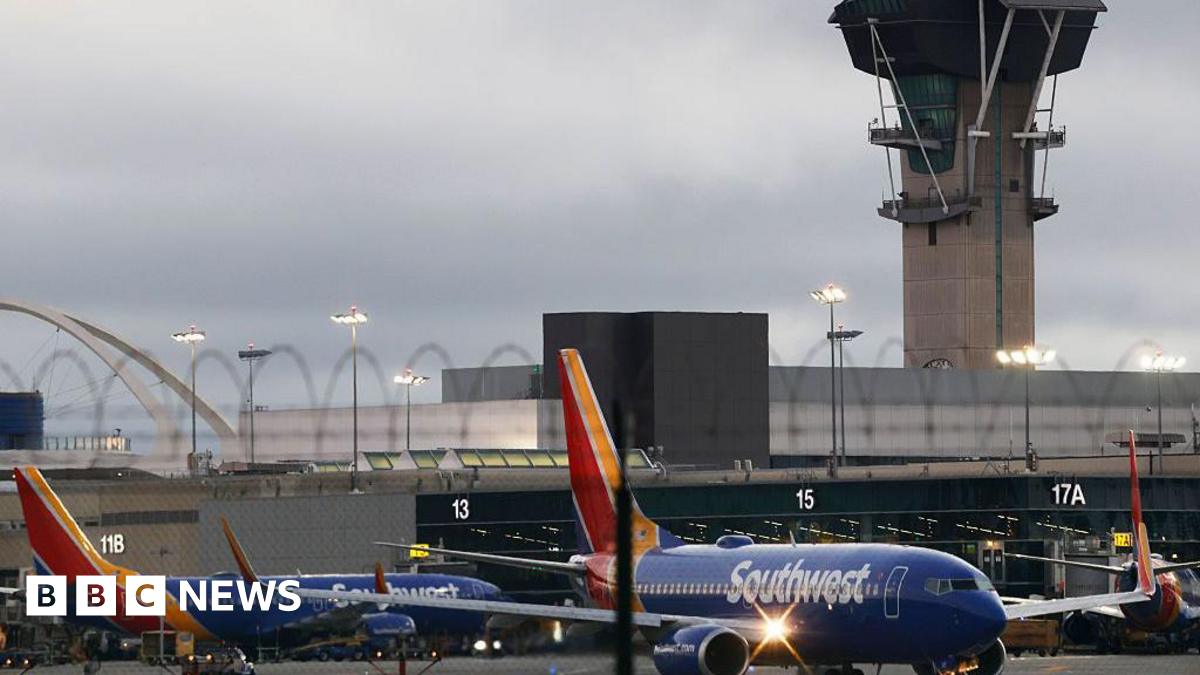 Hundreds of flights cancelled in US as airlines scramble to cut traffic during shutdown - live updates