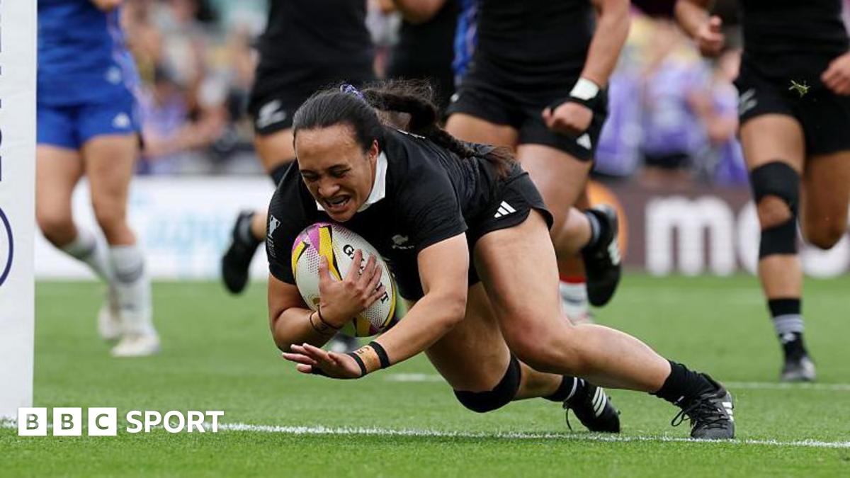 Ruahei Demant dives over the line holding the ball to score a try for New Zealand