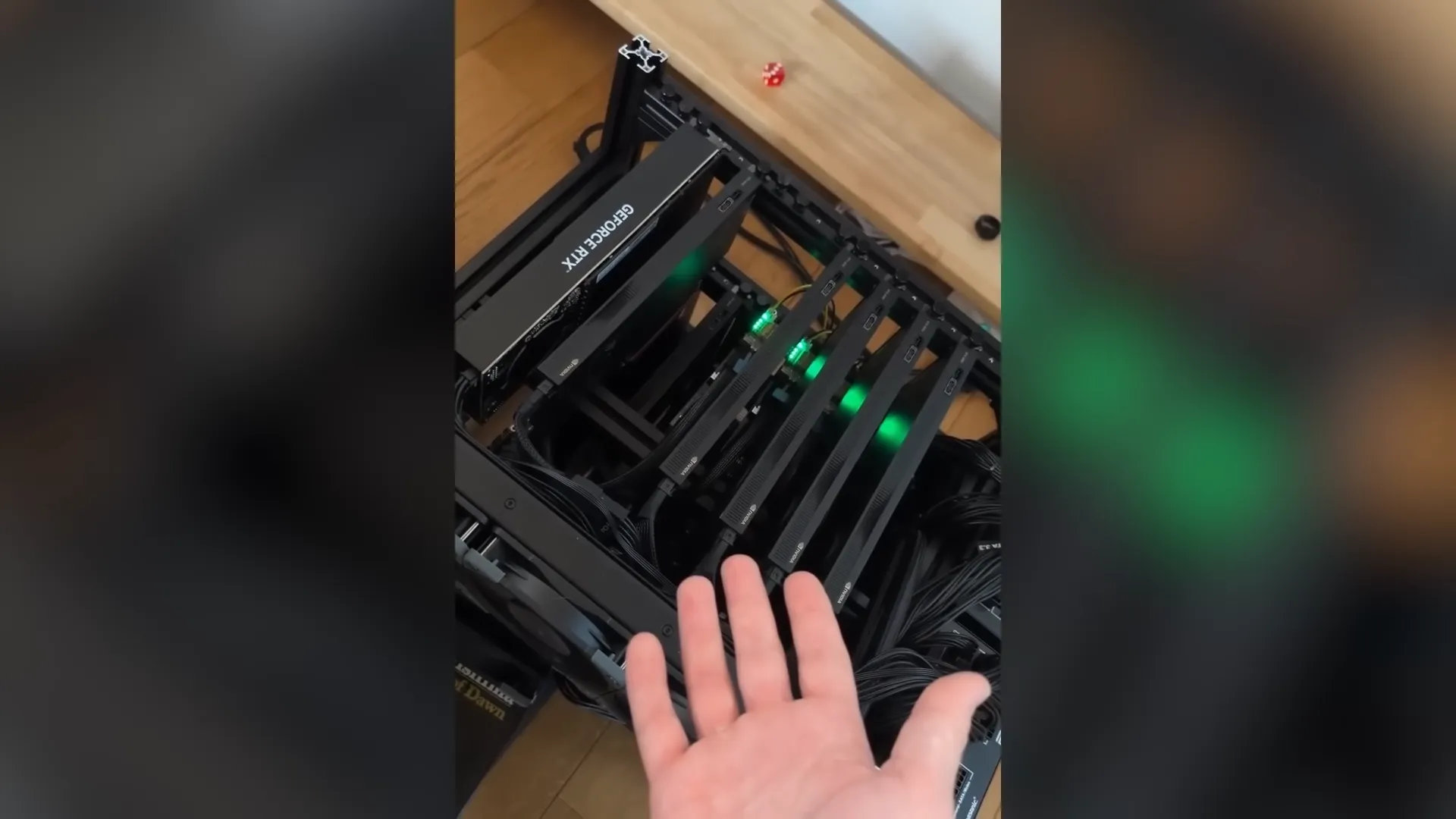 A screenshot of a PewDiePie YouTube video, showing multiple graphics cards in an open chassis