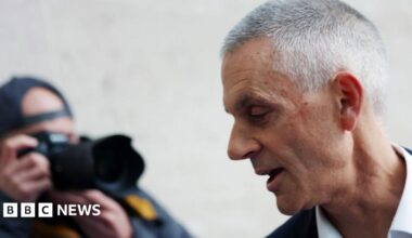 Tim Davie being photographed outside New Broadcasting House