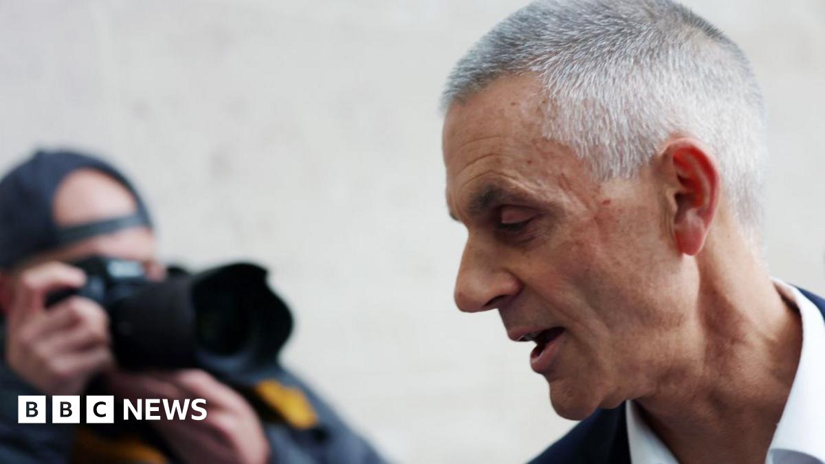 Tim Davie being photographed outside New Broadcasting House