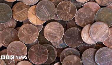 A photo of many US copper pennies stacked in a pile