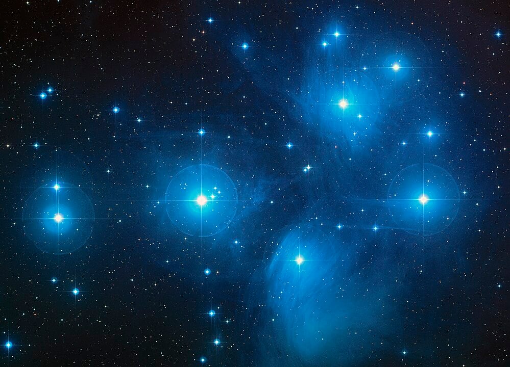 The Pleiades Cluster also known as the Seven Sisters (Credit : NASA, ESA, AURA/Caltech, Palomar Observatory)
