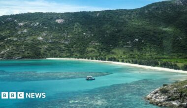 An aerial photo taken on April 4, 2024, shows a boat anchored near coral around Lizard Island on the Great Barrier Reef.