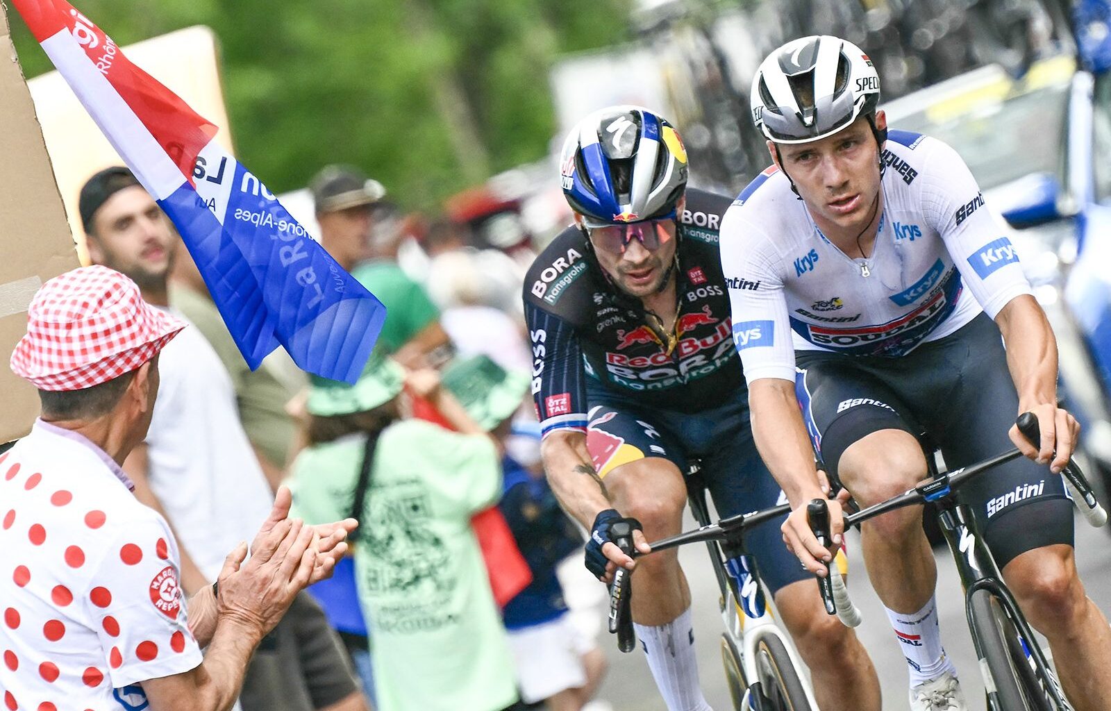 Soudal Quick-Step team's Belgian rider Remco Evenepoel wearing the best young rider's white jersey and Red Bull - BORA - hansgrohe team's Slovenian rider Primoz Roglic cycle in a pursuing group in the final kilometers of the 11th stage of the 111th edition of the Tour de France cycling race, 211 km between &Eacute;vaux-les-Bains and Le Lioran, on July 10, 2024. (Photo by Marco BERTORELLO / AFP) (Photo by MARCO BERTORELLO/AFP via Getty Images)