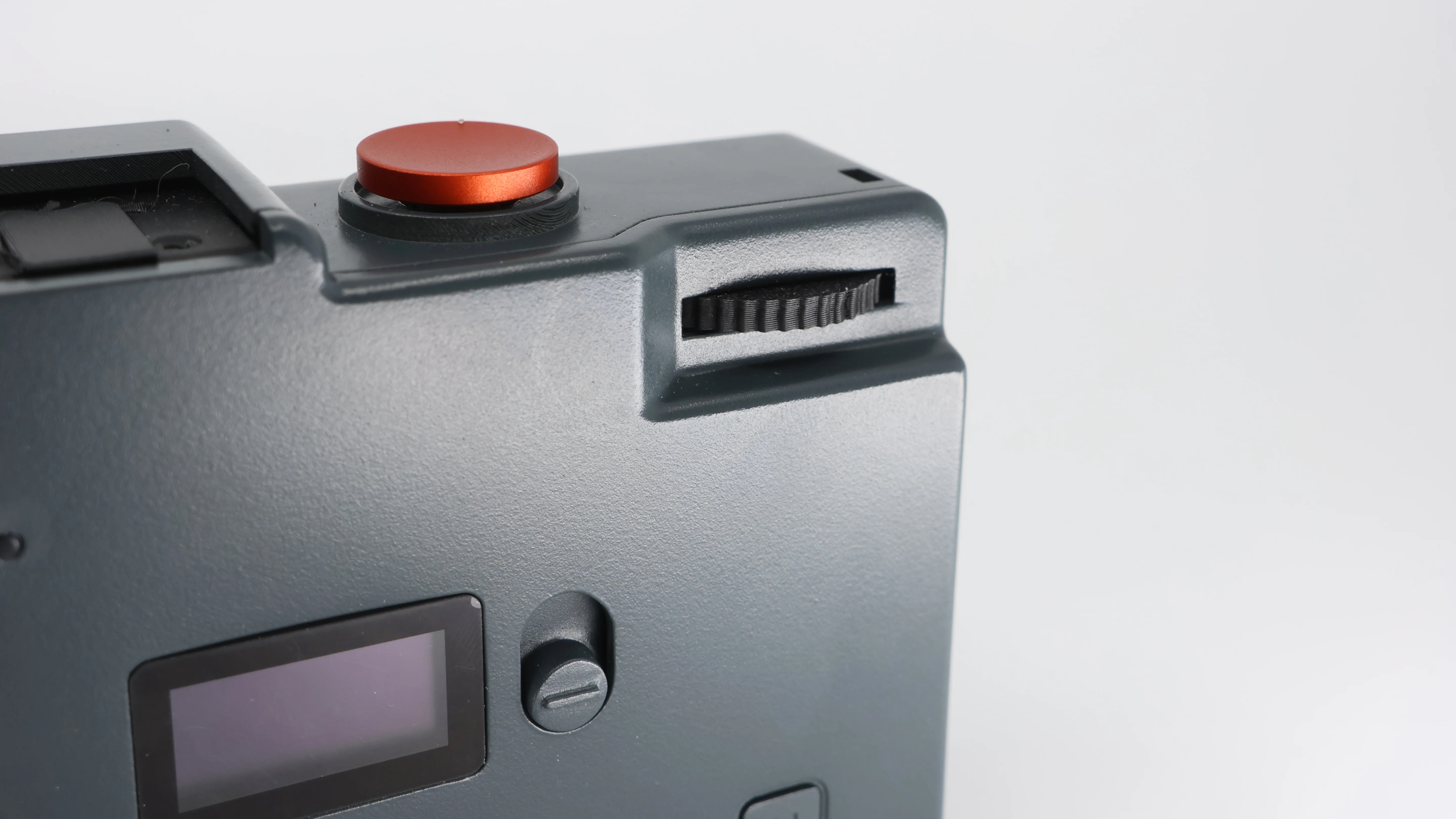 The Rewindpix retro compact camera on a white background