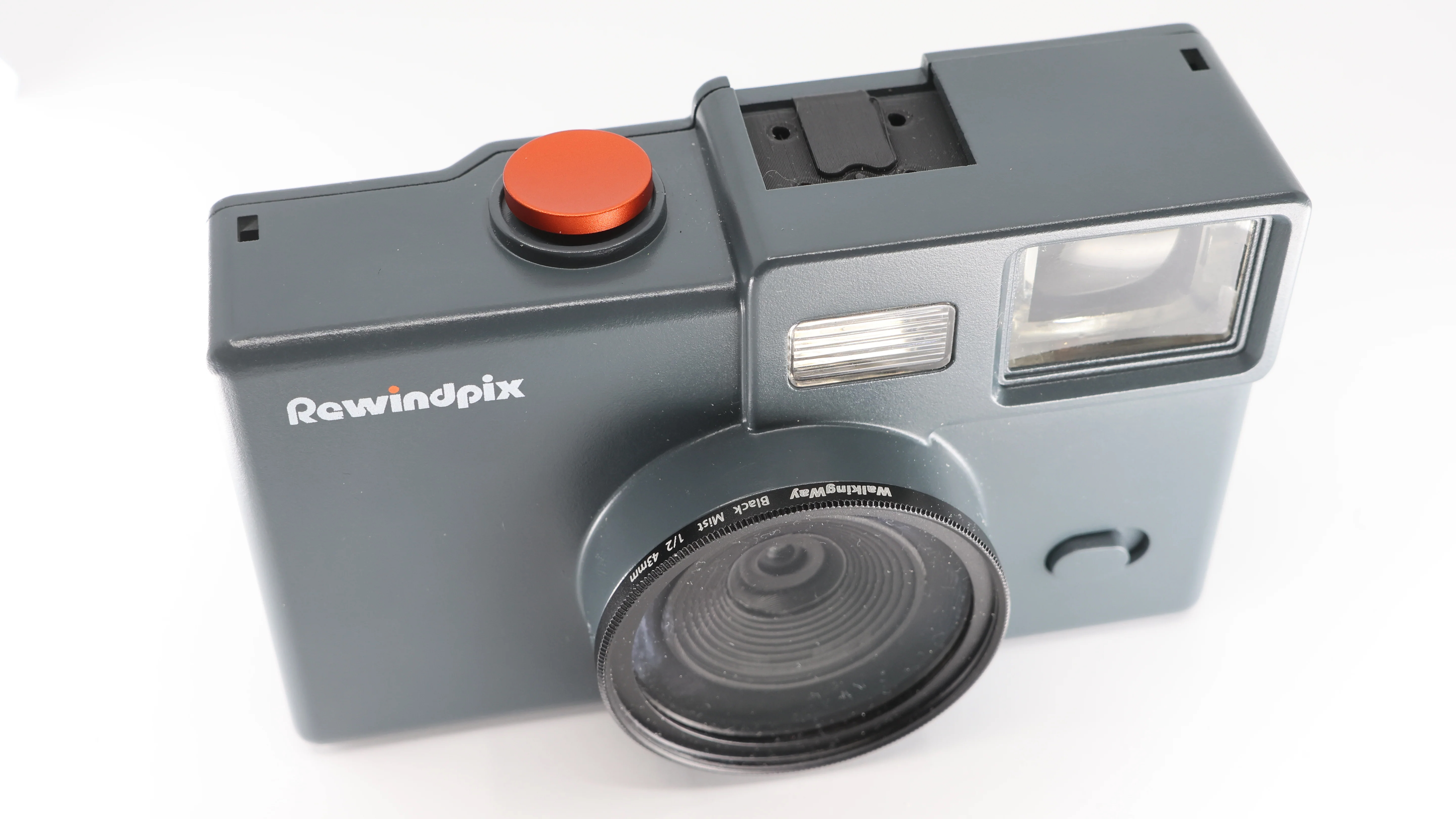 The Rewindpix retro compact camera on a white background