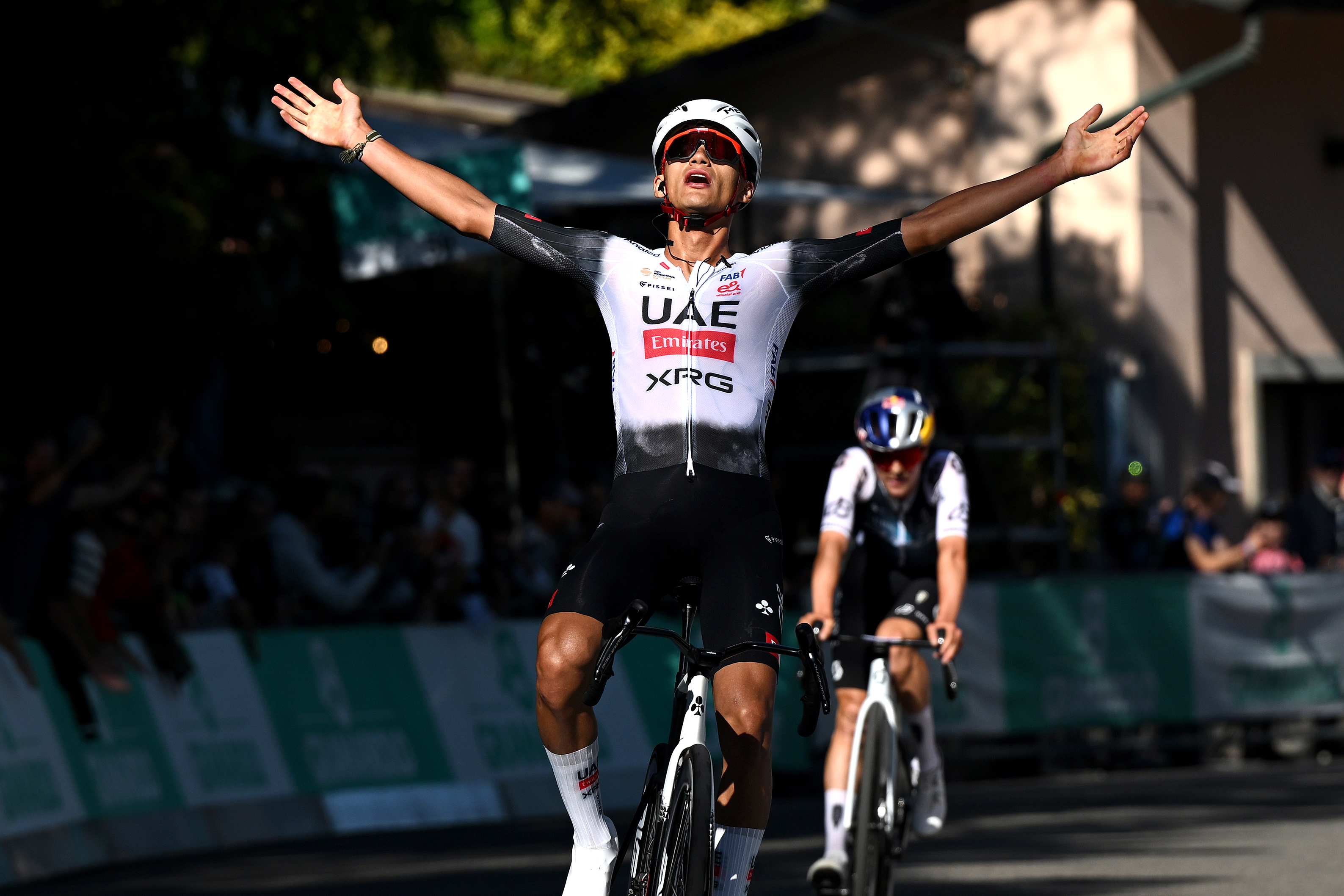 SAN LUCA, ITALY - OCTOBER 04: Isaac Del Toro of Mexico and UAE Team Emirates celebrates at finish line as race winner during the 108th Giro dell'Emilia 2025 a 199.2km one day race from Mirandola to San Luca on October 04, 2025 in San Luca, Italy. (Photo by Dario Belingheri/Getty Images)