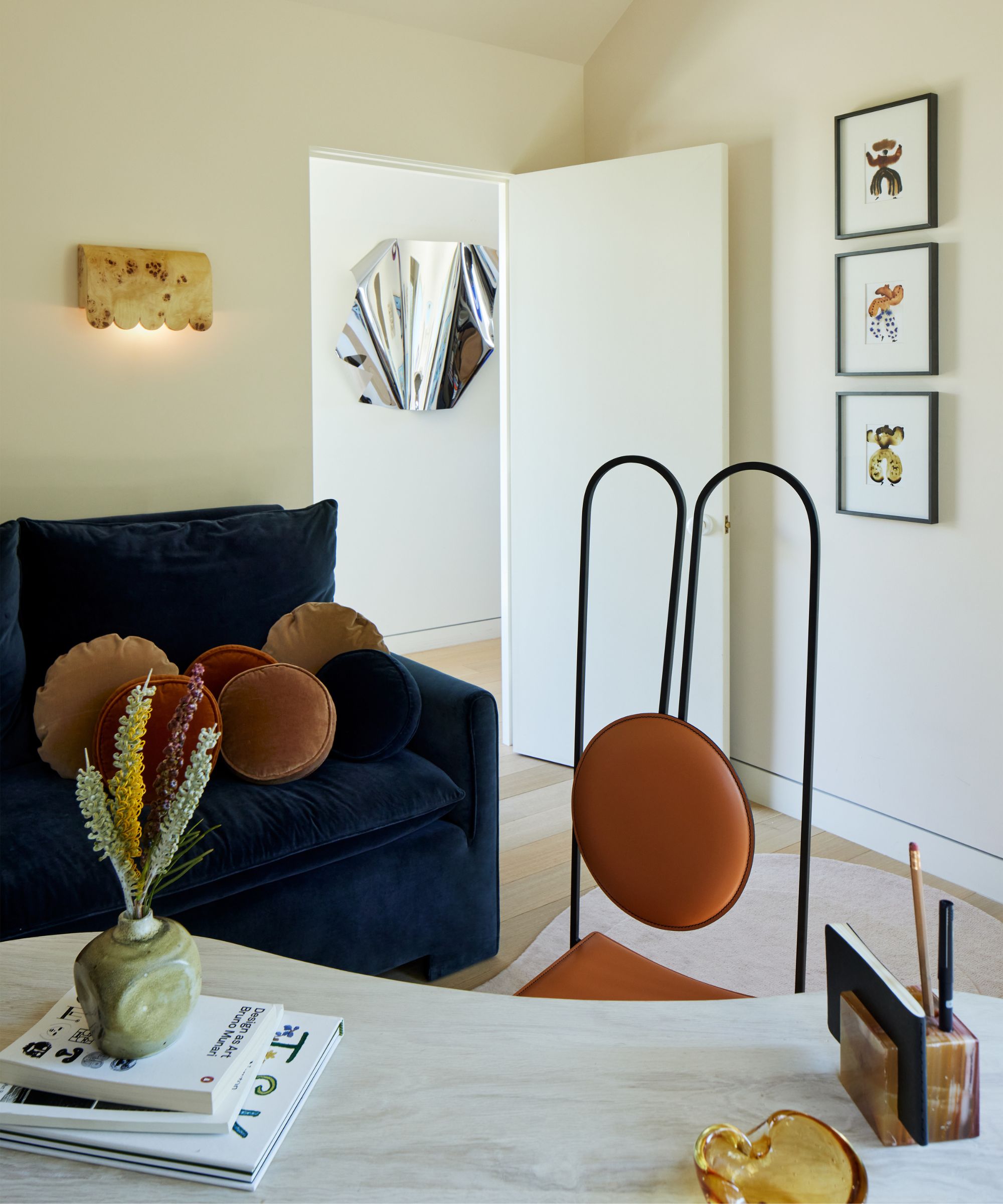 unique office with a large desk and unique artwork and lighting