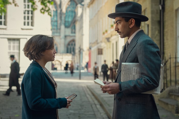 Mia McKenna Bruce and Nabhaan Rizwan in Seven Dials, talking together in the street.
