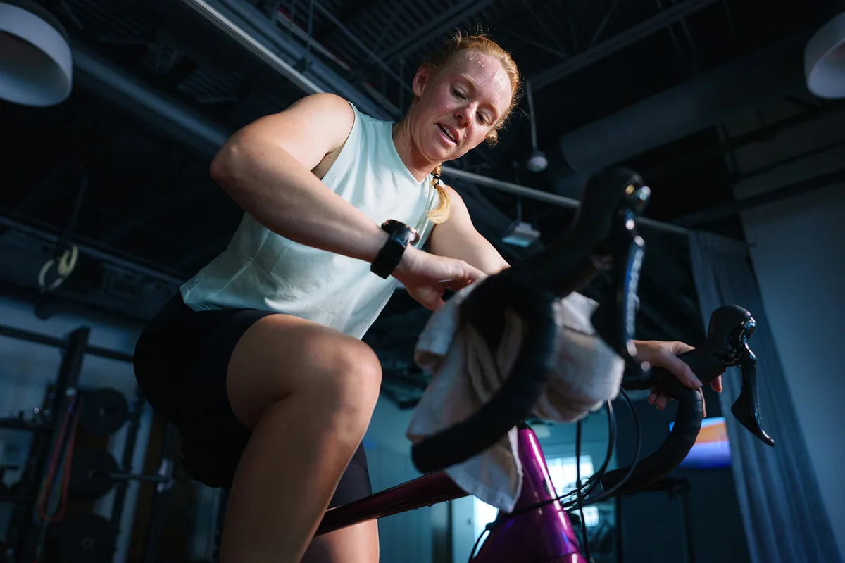 Woman riding on an indoor bike