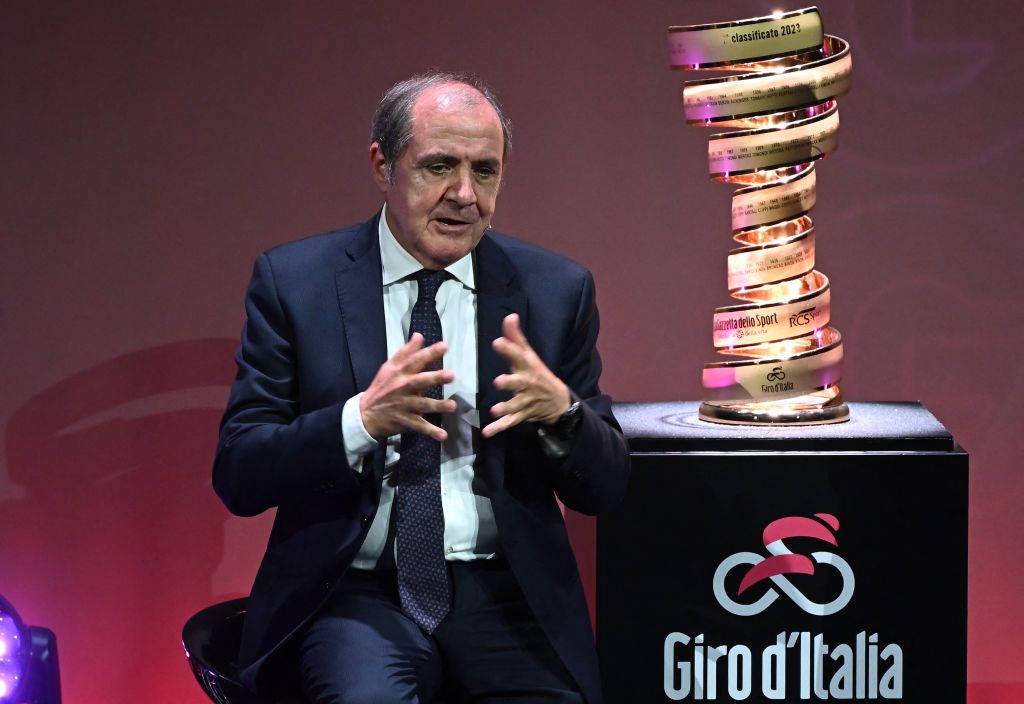 Director of the Giro d'Italia, Mauro Vegni speaks next to the the "Trofeo Senza Fine" (Endless Trophy) race winner's trophy during the presentation of the 2023 Giro d'Italia cycling race on October 17, 2022 in Milan. (Photo by Marco BERTORELLO / AFP)
