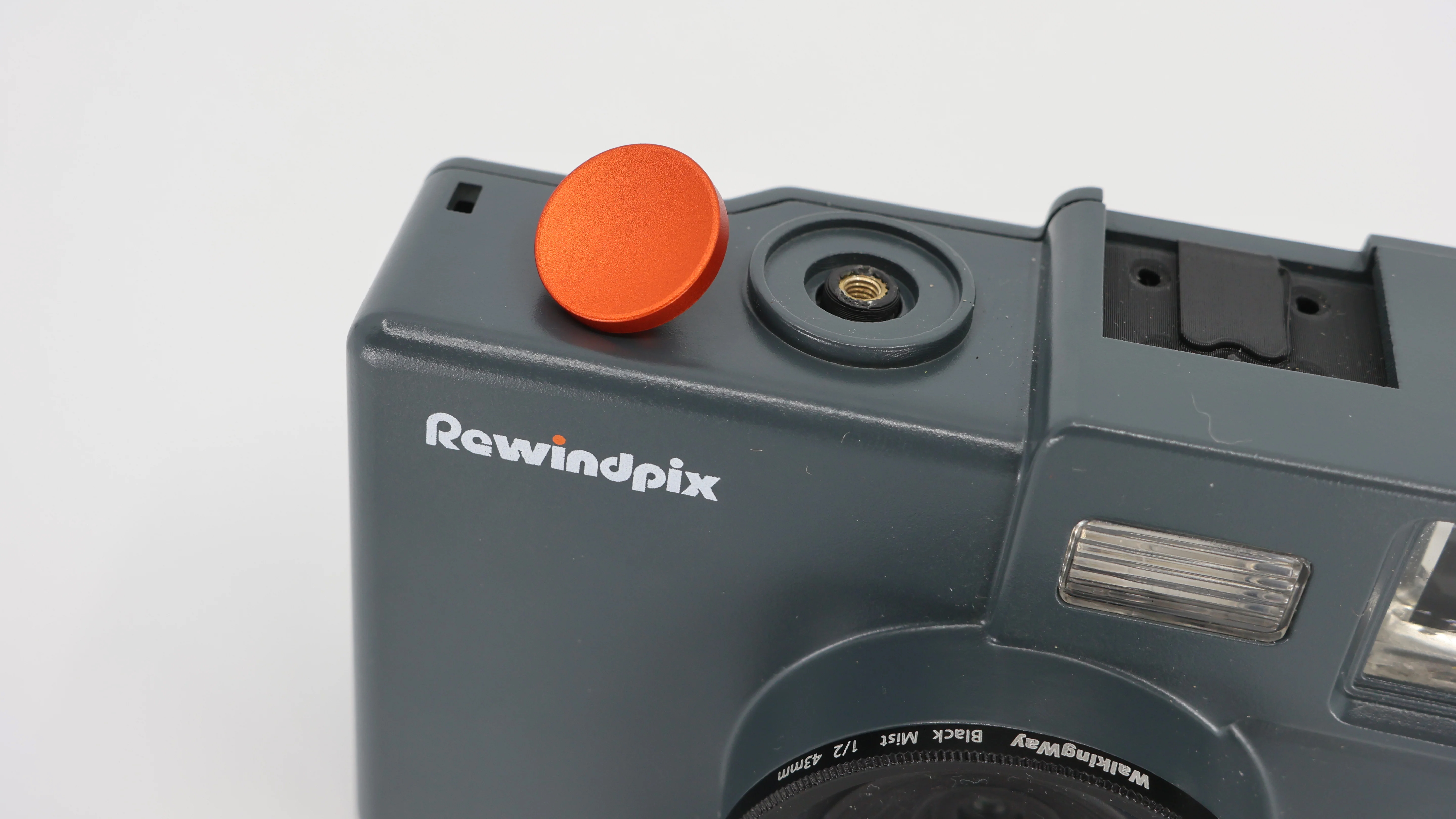The Rewindpix retro compact camera on a white background