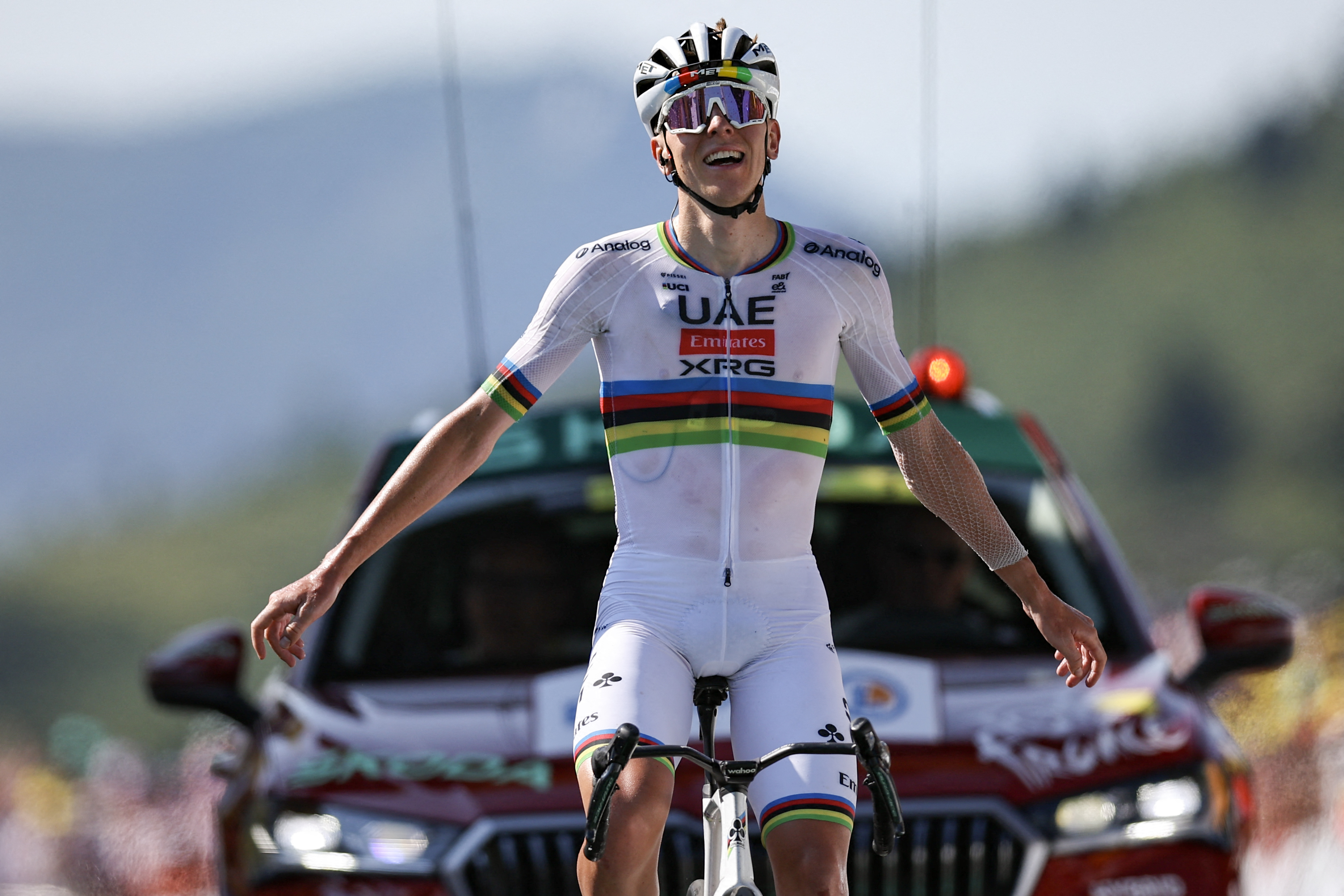 UAE Team Emirates - XRG team's Slovenian rider Tadej Pogacar cycles to the finish line to win the 12th stage of the 112th edition of the Tour de France cycling race, 180.6 km between Auch and Hautacam, in the Pyrenees mountains of southwestern France, on July 17, 2025. (Photo by Anne-Christine POUJOULAT / AFP)