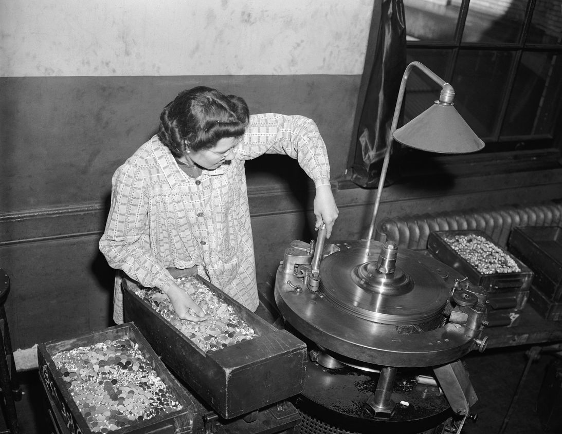 A worker at the Mint making nickels with different metals during World War II, when nickel was needed for the war effort. The Mint is experimenting with once again changing the composition of the nickel, this time to save money.