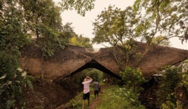 This Bridge-Shaped House Hangs Weightlessly Between Two Forested Hillsides