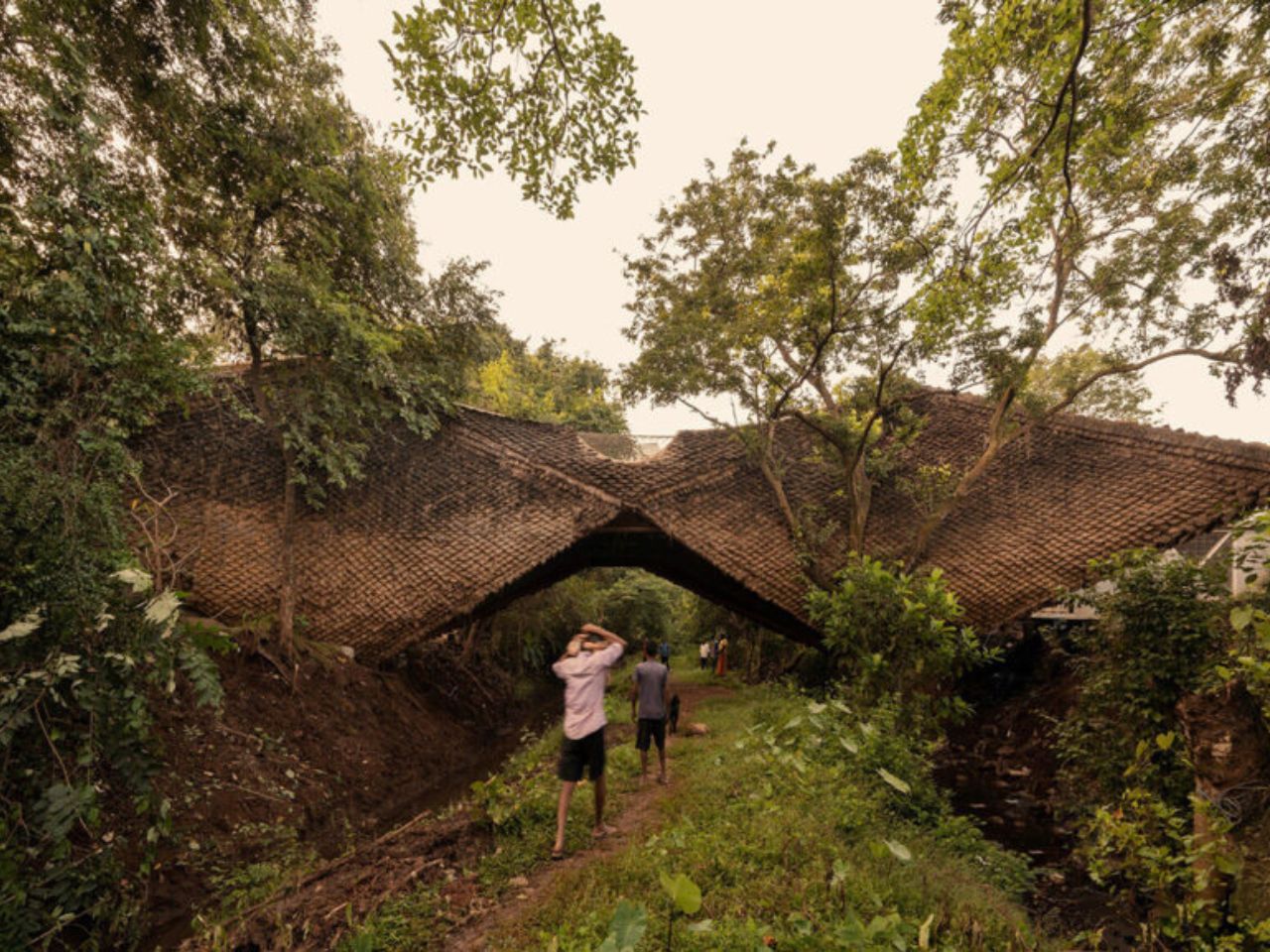 This Bridge-Shaped House Hangs Weightlessly Between Two Forested Hillsides