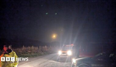 Family having a moment together messing about while winter sea swimming