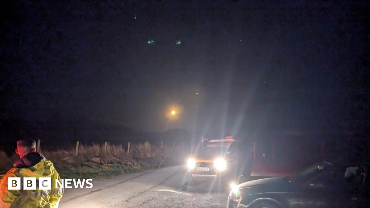 Family having a moment together messing about while winter sea swimming