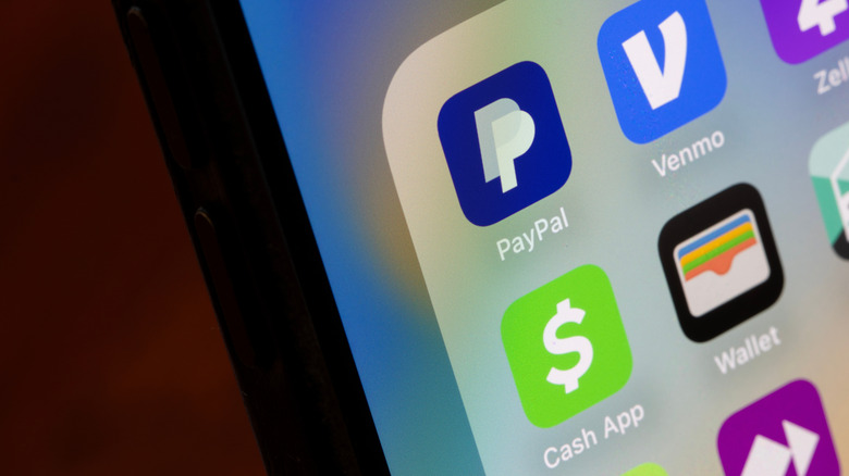 Mobile cash app icons on phone with Cash App visible.