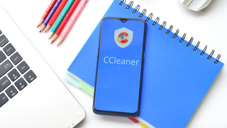 Phone on a desk with CCleaner logo showing on screen
