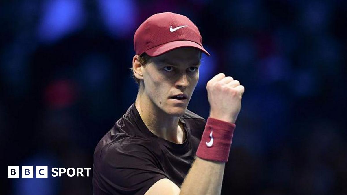 Jannik Sinner pumps his fist in celebration