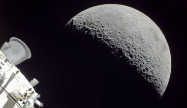 a half-lit moon seen behind the cone-shaped nozzle of a spacecraft engine