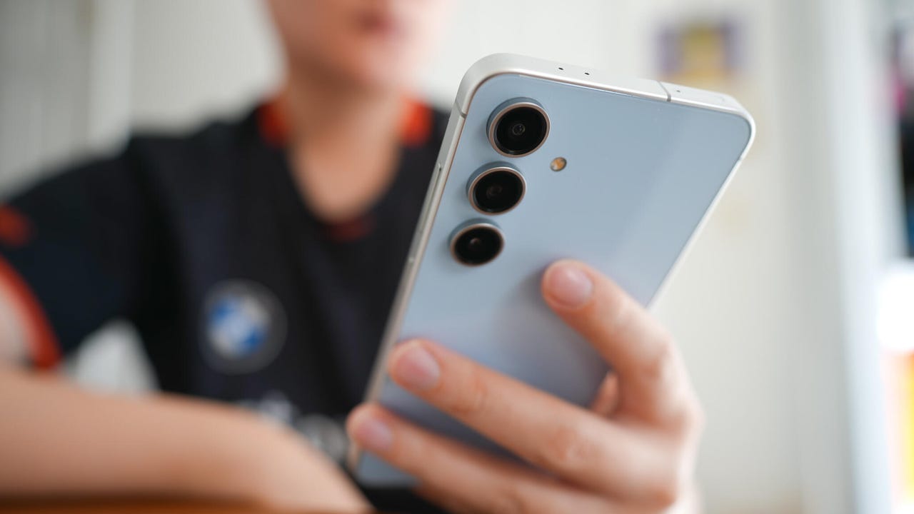 Person holding Samsung Galaxy S24 FE Android Phone